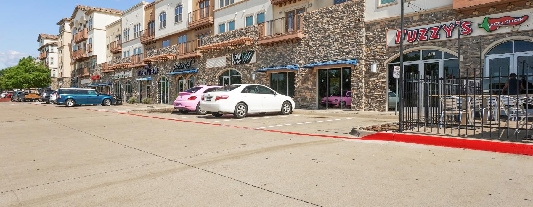 a street with cars parked on the side