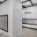 a room with a stone wall and a stone pillar with a door