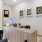 a living room with a desk and a computer