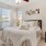 a bedroom with a bed and a fan
