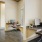 a room with a desk and chairs
